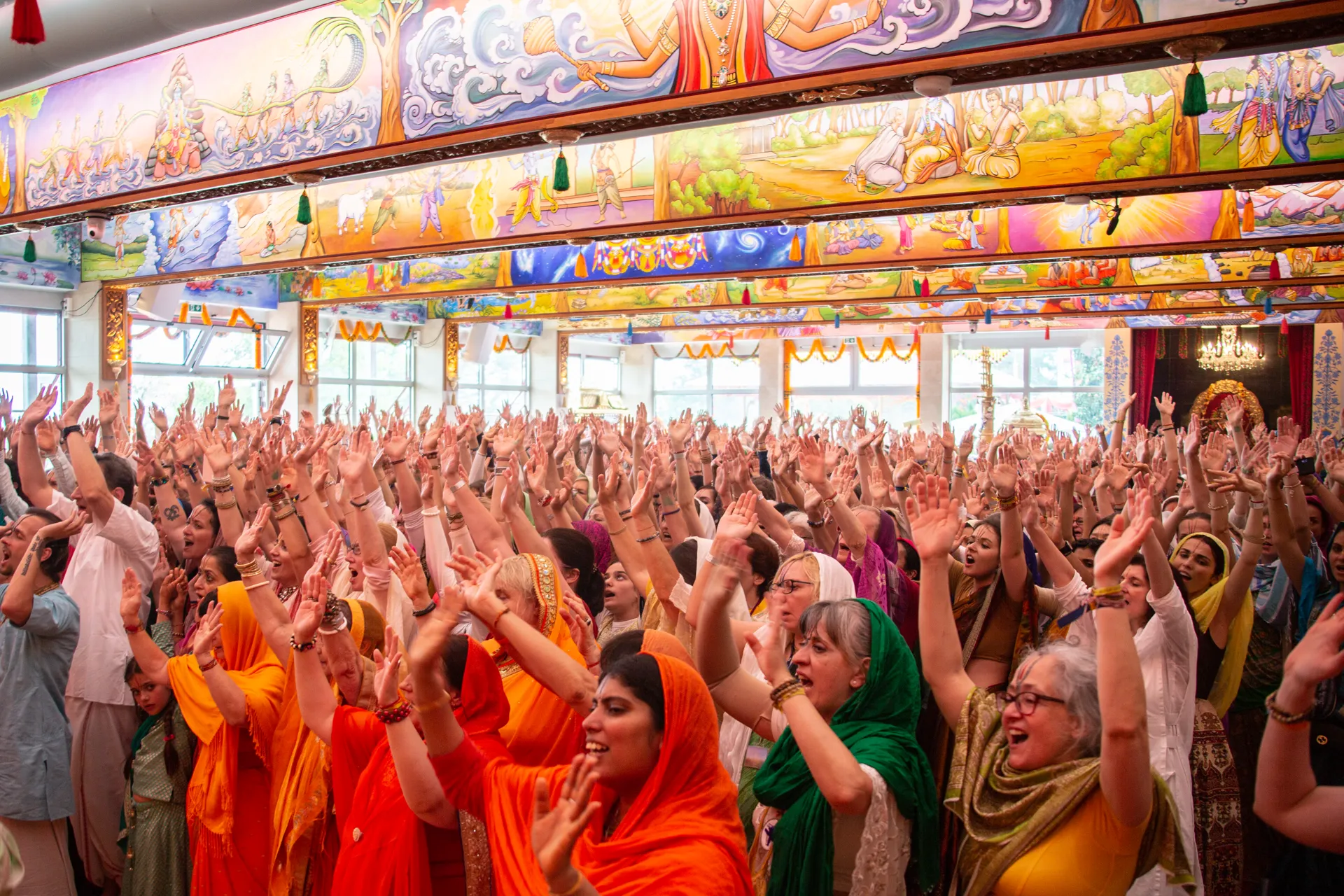 event with paramahamsa vishwananda and people dancing in the temple