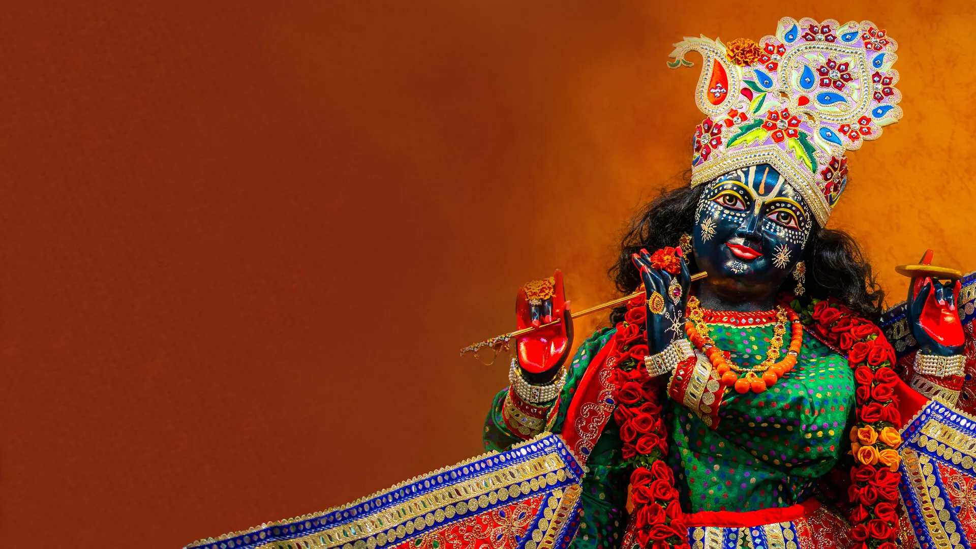 hindu deity, krishna holding a flute