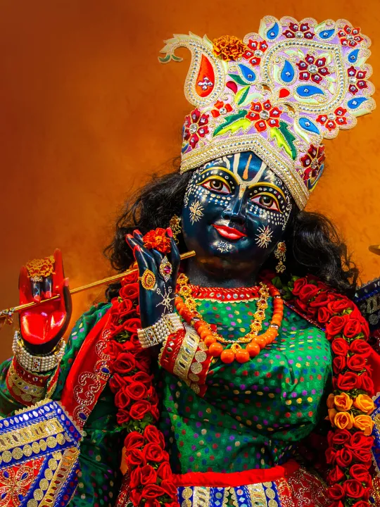hindu deity, krishna holding a flute