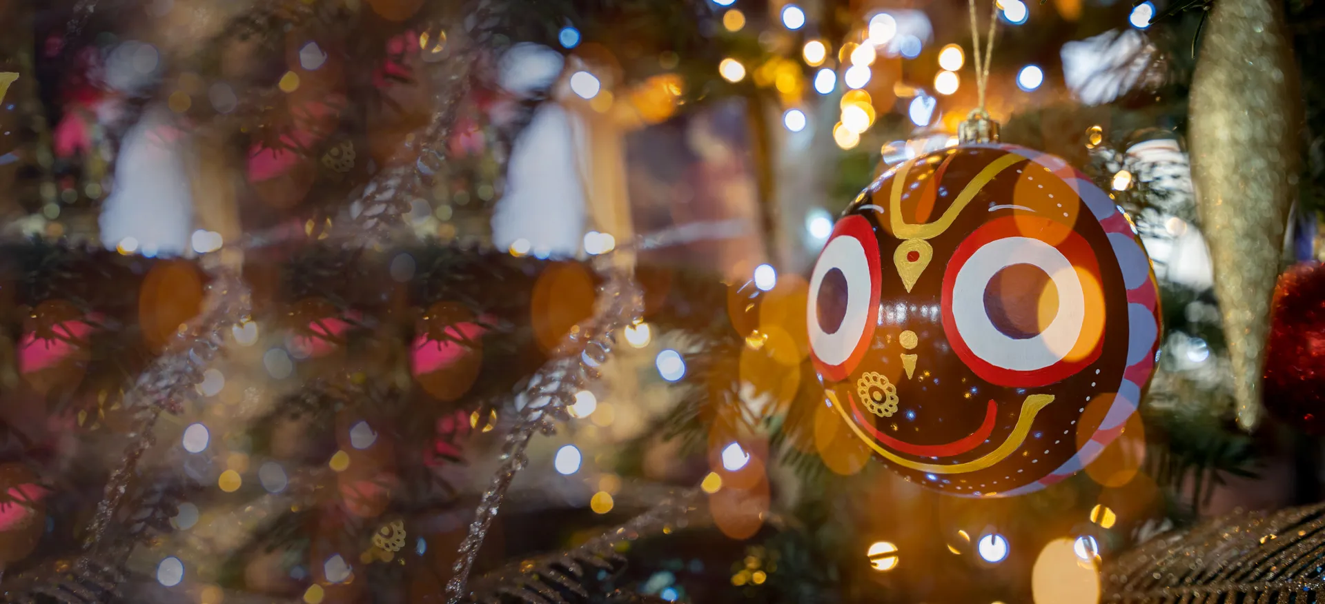 christmas tree with decoration resembling the hindu god jagannath