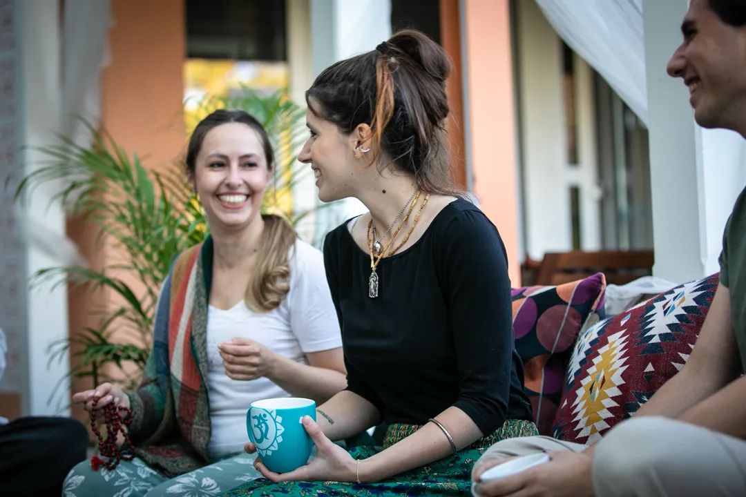 young people smiling and talking, being together as a community